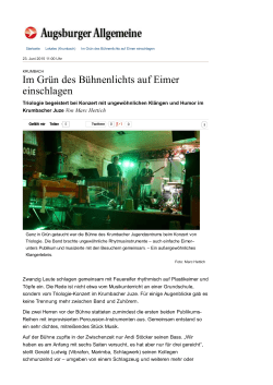 Im Gr&uuml;n des B&uuml;hnenlichts auf Eimer einschlagen